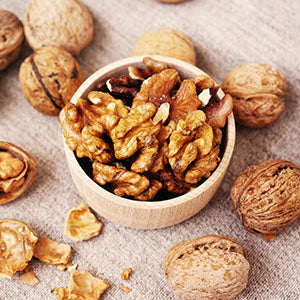 A bowl of walnuts, which are natural stress relieving foods.